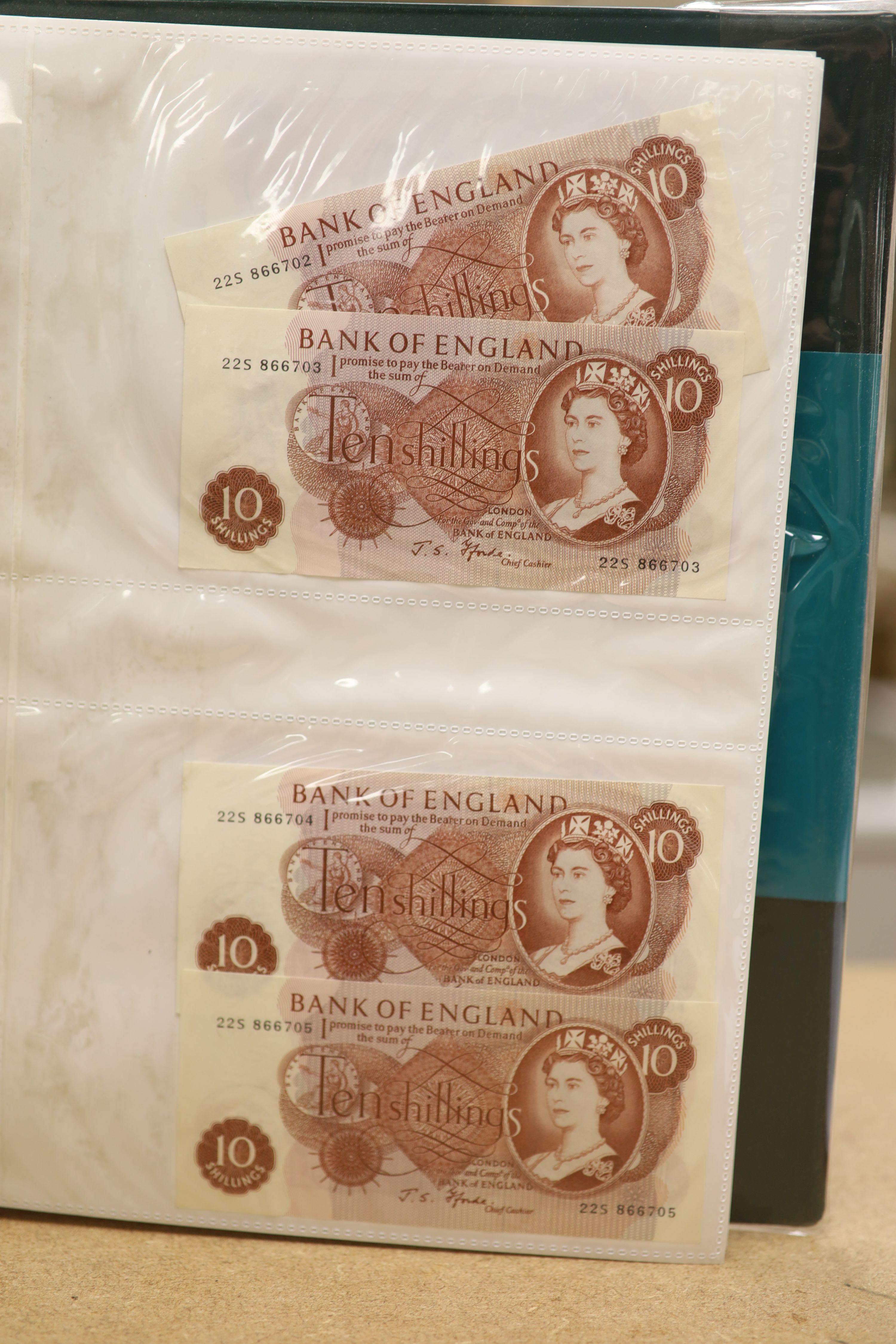 A collection of Bank of England and Scottish banknotes to include: 21 QEII 10 shillings, 14 O'Brien and Beale 10 shillings, 1 Peppiatt 10 shillings, 4 Hallam one pound notes, 18 O'Brien or Beale one pound notes, 8 Peppia